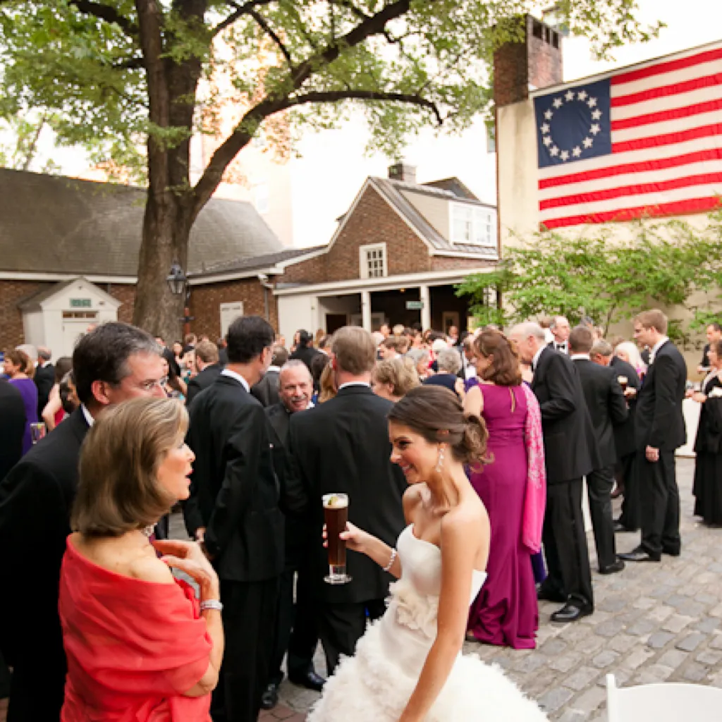 Guests at a wedding enjoying themselves in the Betsy Ross courtyard