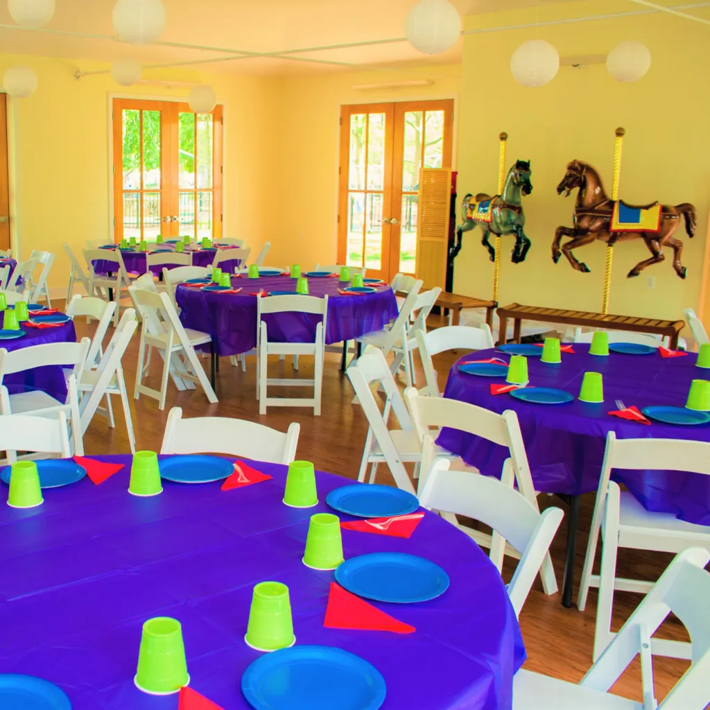 Tables set with colorful party supplies at the Franklin Square Pavilion room