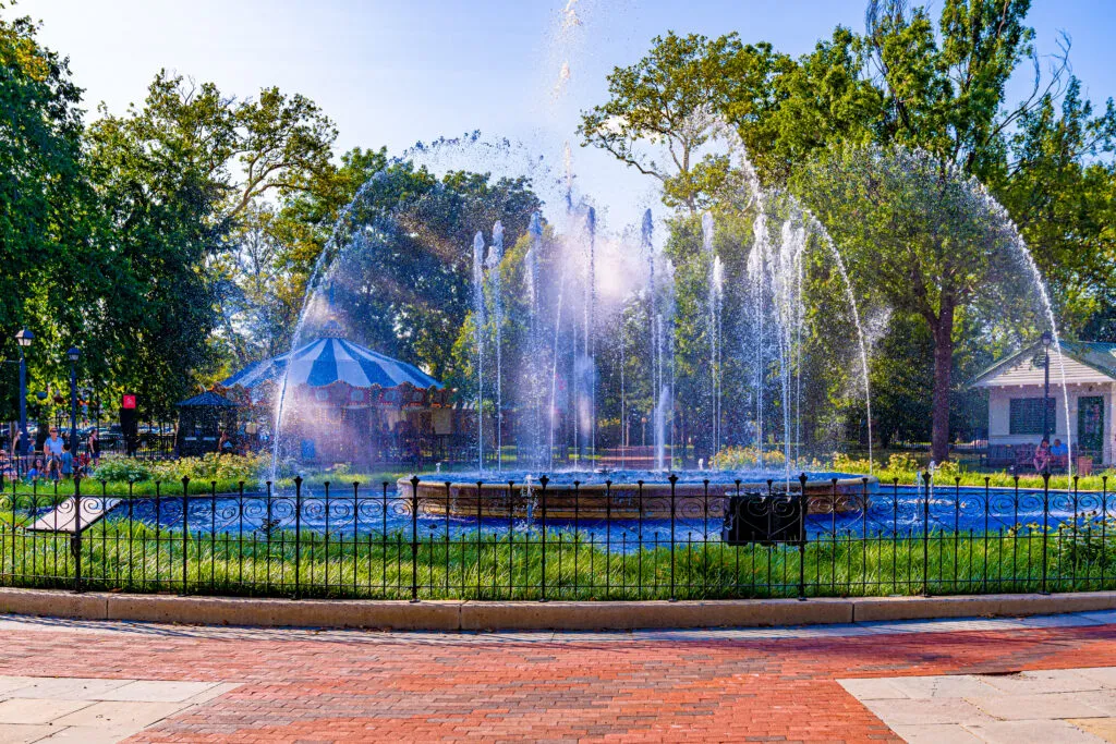 The Franklin Square Rendell Family Fountain shoots spurts of water on a sunny day