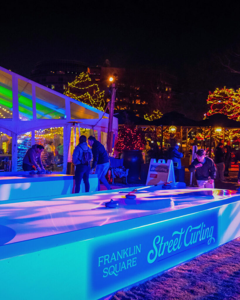 Photo of people having fun curling at Winter In Franklin Square
